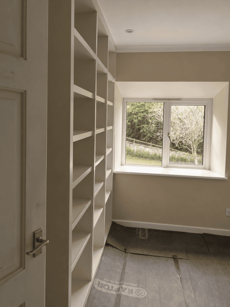 Built-in shelving fitted into an alcove in a Cornish cottage, Bodmin